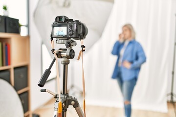 Wall Mural - Caucasian woman posing as model at photography studio