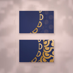 Wall Mural - Visiting business card in dark blue with Indian gold ornaments for your contacts.