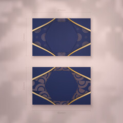 Wall Mural - Visiting business card in dark blue with Indian gold pattern for your contacts.