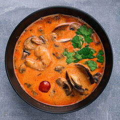 Sticker - Traditional spicy Thai soup Tom Yum with shrimp and seafood, classic dish of cuisine of Thailand