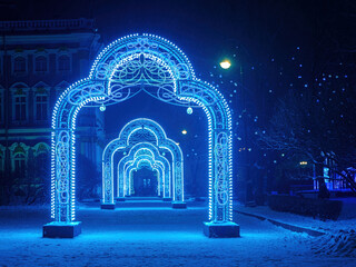 Wall Mural - Saint Petersburg christmas. Russia winter. Christmas arches on streets of St. Petersburg. Arches with New Year's illumination. Fragment of winter palace. Saint Petersburg tourism. New Year in Russia