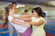 © JackF - Pair of teenager school girls practicing new self-defense moves during training in gym