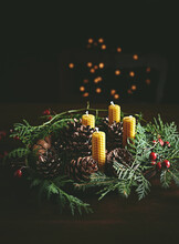 Hand Crafted Rustic Christmas Wreath With Beeswax Candles, Cones And Evergreen Sprigs . Copy Space