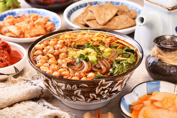  Hot and sour soup noodles on wood table