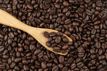 Canvas Print - roasted coffee beans with wooden spoon