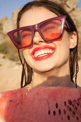 woman eating watermelon outdoors Sun summer close-up