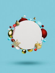 Wall Mural - Round blank frame bordered with Christmas tree balls and candy cane flying against pastel blue background. Creative New Year and Xmas concept. Minimal celebration empty greeting card mock up template.