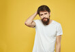© SHOTPRIME STUDIO - bearded man in a white t-shirt serious look close-up