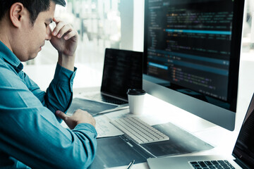 Wall Mural - software developers headache with code analysis in the office.