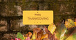 © vectorfusionart - Image of happy thanksgiving text over bricks with autumn leaves
