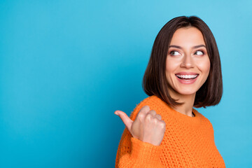 Canvas Print - Profile side view portrait of attractive cheerful girl demonstrating copy space ad new isolated over bright blue color background