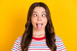 © deagreez - Photo of young funky funny crazy little girl with funky showing tongue playful humorous isolated on yellow color background