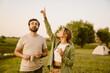 © Drobot Dean - White couple talking and eating sandwiches while hiking together