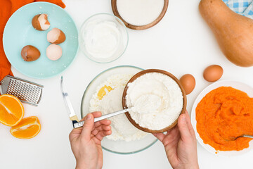 Wall Mural - step-by-step recipe for pumpkin curd casserole in the shape of a zebra, orange autumn pie with orange. mixing ingredients for pumpkin pie top view