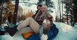 © vadim_key - Two attractive multiethnic happy women smile sledging on snow slope towards camera, winter weekend fun slow motion.