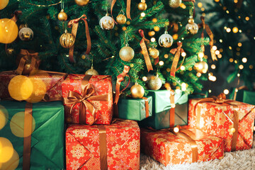 Wall Mural - many gift boxes standing under decorated christmas tree.