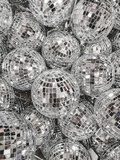 Fototapeta Zwierzęta - Sale of little disco balls for Christmas tree. Decorative mirror balls for New Year celebration.