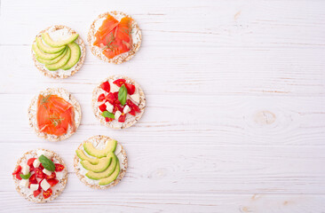 Wall Mural - Rice cake with  salmon avocado mozzarella  and tomatoes