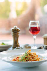 Poster - Spaghetti pasta with tomatoes and shrimps in a restaurant of italian food