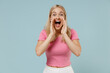 © ViDi Studio - Young promoter caucasian blonde woman 20s wearing casual pink t-shirt scream shout hot news about sales discount with hands near mouth isolated on plain pastel light blue background studio portrait
