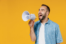 Young Expressive Happy Man 20s Wearing Blue Shirt White T-shirt Hold Scream In Megaphone Announces Discounts Sale Hurry Up Isolated On Plain Yellow Background Studio Portrait People Lifestyle Concept