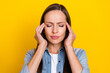 © deagreez - Photo of young woman arms touch head feeling bad unhealthy migraine isolated over yellow color background