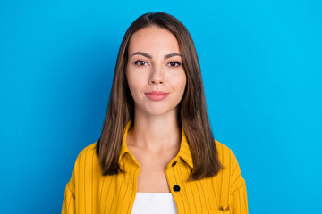 Wall Mural - Photo of cute young brunette lady wear yellow shirt isolated on blue color background