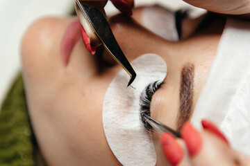 Wall Mural - Woman Eye with Long Eyelashes. Eyelash Extension. Lashes, close up, selected focus.