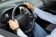 © Prostock-studio - Unrecognizable businessman driving comfy auto, holding hands on steering wheel