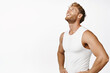 Image of smiling sportsman workout in gym, looking pleased after fitness training, standing over white background