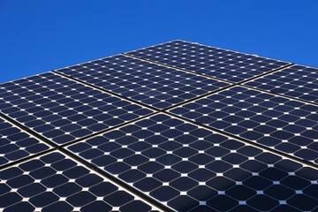 Solar energy.Solar panels close-up on blue sky background. alternative renewable energy from nature. renewable energy.solar power farm.solar power technology. Alternative energy sources.