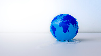 water conservation concept wet blue globe on a white background