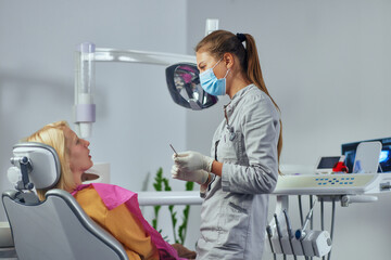 Wall Mural - Dentist and patient at clinic