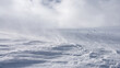 Snowy slope surface. Selective focus. Winter background.