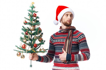 Wall Mural - handsome man in a santa hat Christmas decorations holiday New Year isolated background