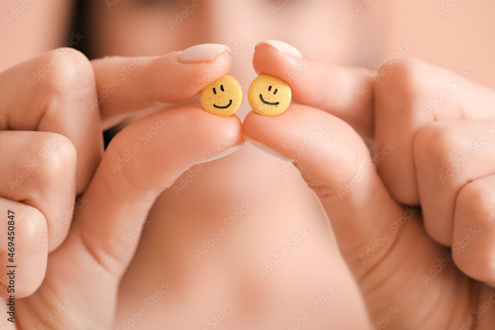 Hands of woman with pills, closeup