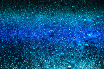 Wall Mural - frozen water drops blue background