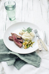 Beef steak on cauliflower puree with zucchini vegetables (low carb)