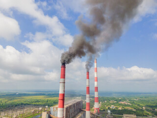 plant pipe with smoke against blue sky