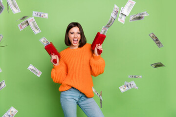 Wall Mural - photo of excited lady shoot gun dollars business earnins casino victory wear orange pullover isolate