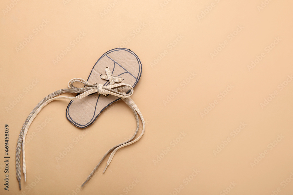 Shoe lacing card with laces on color background