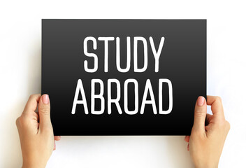 STUDY ABROAD text on card, concept background
