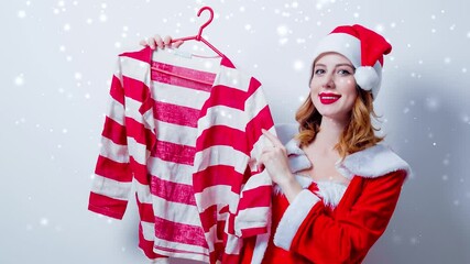 Wall Mural - Portrait of Young Santa Claus girl in red clothes with shirt on white background