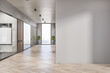 Modern white concrete and wooden office interior corridor with empty mock up place on wall, glass, partition and furniture, daylight, window with city view. Workplace concept. 3D Rendering.