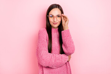 Poster - Photo of lovely young brunette lady try eyewear wear pink pullover isolated on pastel color background