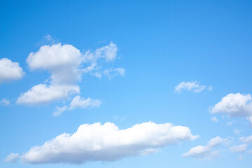 High, fluffy clouds against the blue sky. Beautiful view of the blue sky. Heavenly background.
