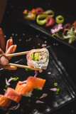Fototapeta Kuchnia - Perfect Sushi Japanese Asian Seafood Food Dish Menu Gourmet Restaurant Chef on Dark Background