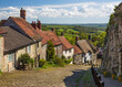 © robertharding - Gold Hill, cobbled lane lined with cottages and views over countryside, Shaftesbury, Dorset