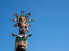 Kwakwaka'wakw Totem Poles In The Cemetery In Alert Bay, Cormorant Island, British Columbia, Canada