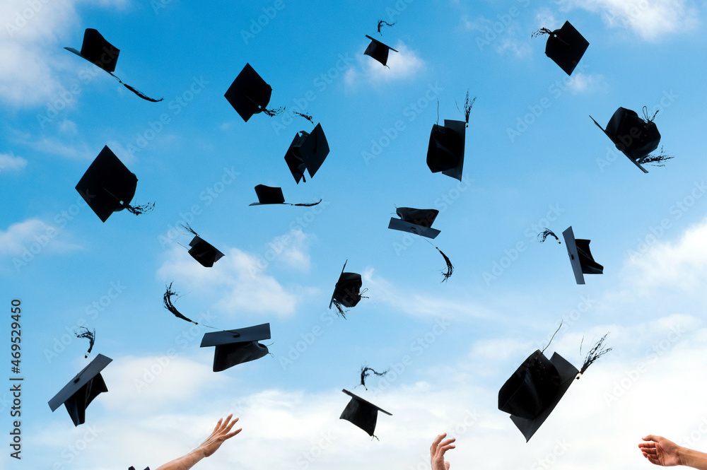 Graduating students hands throwing graduation caps in the air 스톡 사진 ...